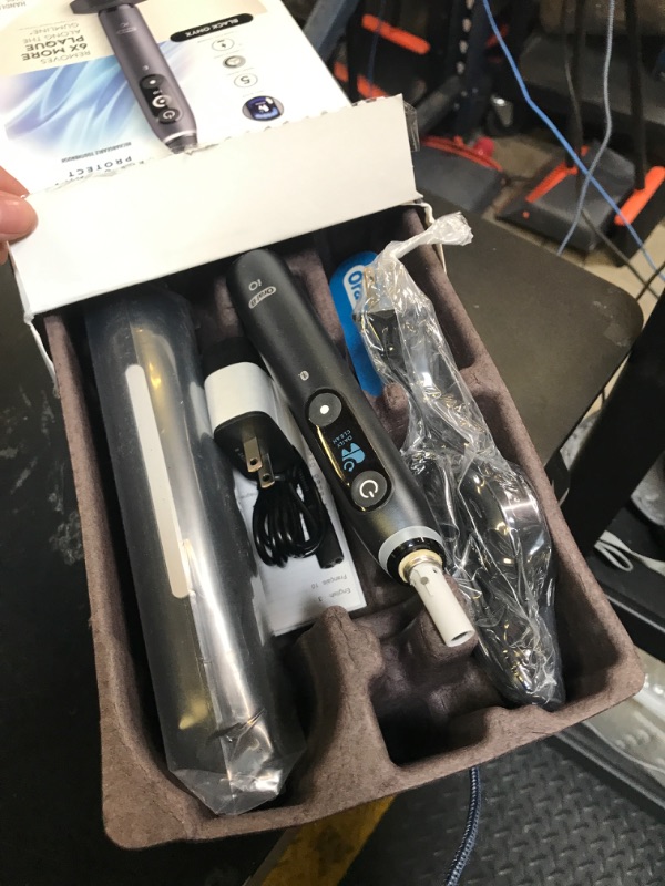 Photo 1 of Oral-B iO Deep Clean + Protect Rechargeable Electric Toothbrush, Black with a iO Series 7 Toothbrush, 2 Replacement Brush Heads, and a Charging Travel Case