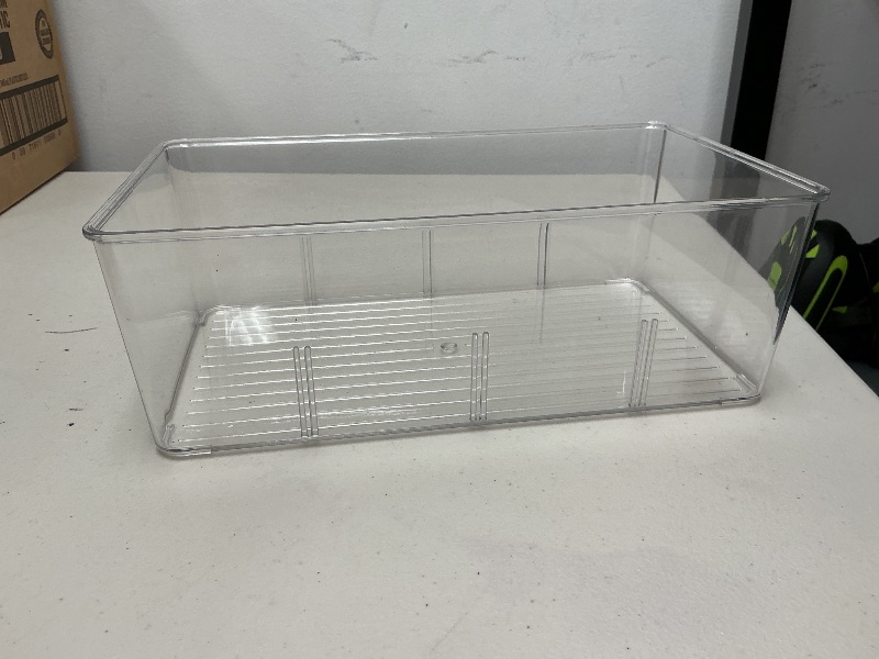 Photo 1 of Clear plastic bin 