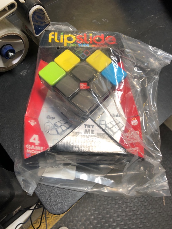 Photo 1 of Flipslide Game - Electronic Handheld Game | Addictive Multiplayer Puzzle Game of Skill | Flip, Slide & Match Colors to Beat the Clock | 4 Thrilling Game Modes | Ages 8+ | Includes Batteries