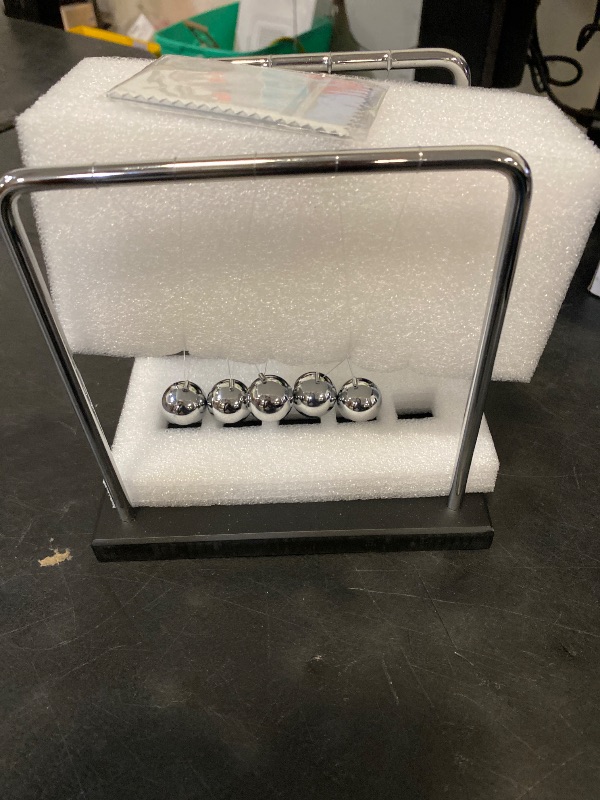 Photo 1 of SEVNPRIME 5 Large Beads Newton's Cradle Balance Balls Desk Toys Office Decorations with Black Wooden Base Desk Balance Balls Fun Science Physics Toys for Office/Bedroom/Living Room