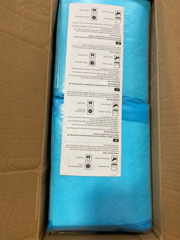 Photo 1 of Amazon Basics X-Large Absorbent Puppy Pads, Leak-Proof, Quick-Dry, 28 x 34 Inches, Pack of 50, Blue & White