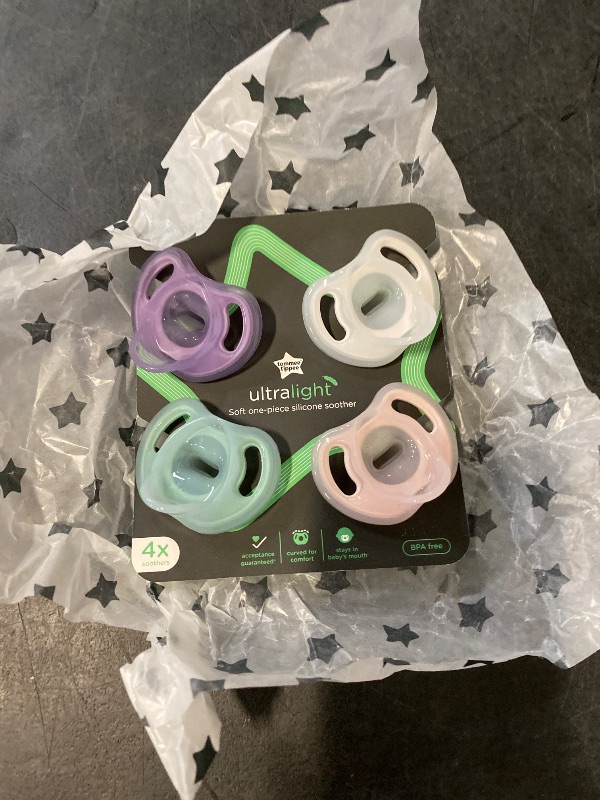 Photo 1 of Tommee Tippee Ultra-Light Silicone Pacifier, 0-6 Months, Symmetrical One-Piece Design, BPA-Free Silicone Binkies, Pink/Purple/Green, Pack of 4