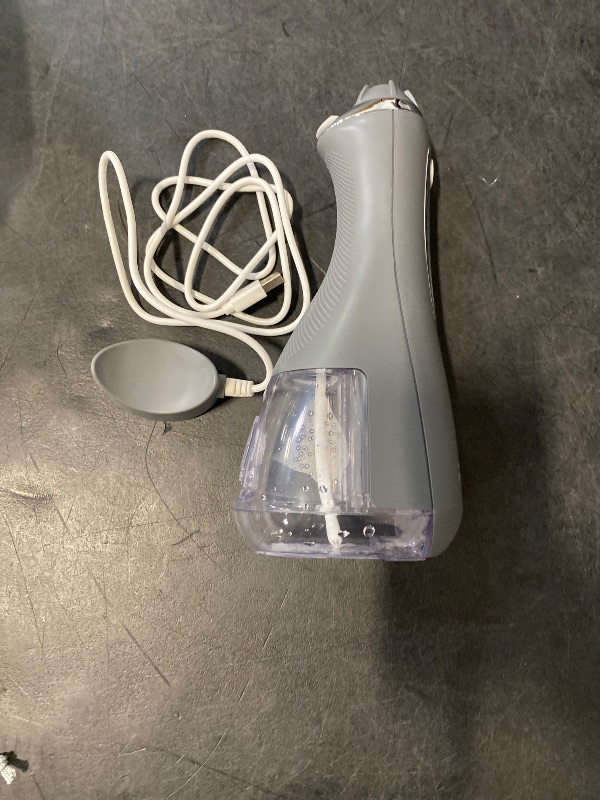Photo 1 of Waterpik Cordless Advanced 2.0 Water Flosser For Teeth, Gums, Braces, Dental Care With Travel Bag and 4 Tips, ADA Accepted, Rechargeable, Portable, and Waterproof, Gray WP-587, Packaging May Vary