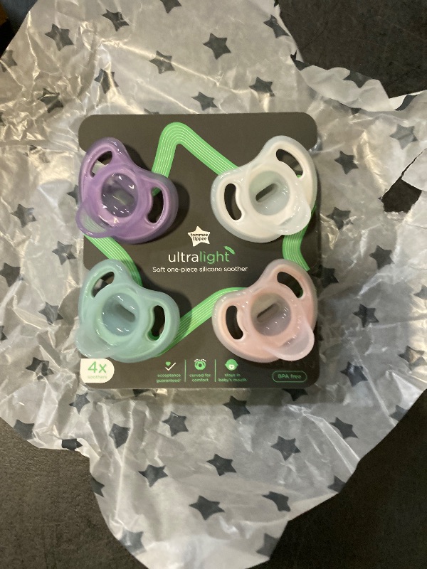 Photo 1 of Tommee Tippee Ultra-Light Silicone Pacifier, 0-6 Months, Symmetrical One-Piece Design, BPA-Free Silicone Binkies, Clear/Green/Pink, Pack of 4