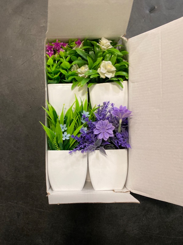 Photo 1 of Der Rose 4 Pack Small Fake Flowers Plants Mini Artificial Potted Plants for Centerpiece Table Decorations Desk Home Bathroom Office Decor