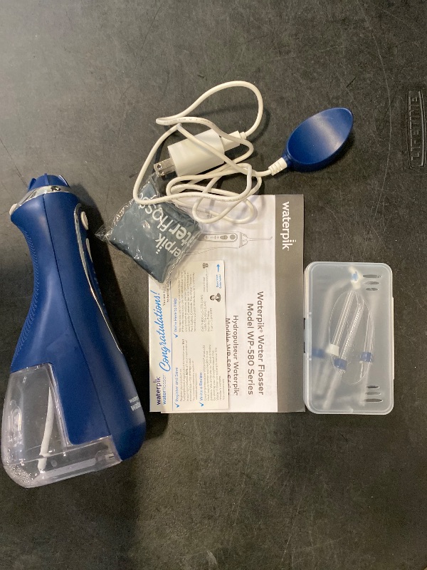 Photo 1 of Waterpik Cordless Advanced 2.0 Water Flosser For Teeth, Gums, Braces, Dental Care With Travel Bag and 4 Tips, ADA Accepted, Rechargeable, Portable, and Waterproof, Blue WP-583, Packaging May Vary