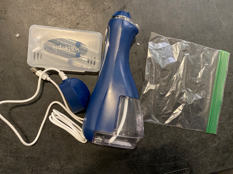 Photo 1 of Waterpik Cordless Advanced 2.0 Water Flosser For Teeth, Gums, Braces, Dental Care With Travel Bag and 4 Tips, ADA Accepted, Rechargeable, Portable, and Waterproof, Blue WP-583, Packaging May Vary