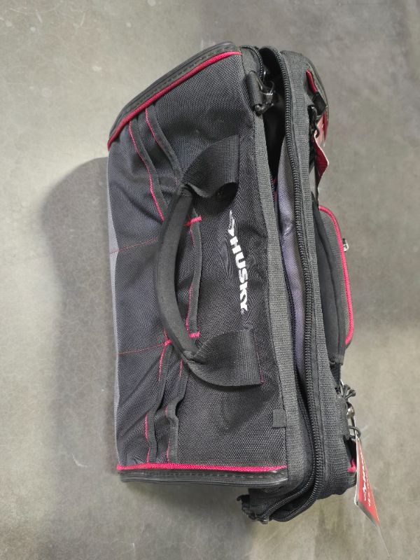 Photo 1 of Husky 18 in. Tech Tool Bag - Dimensions: 11 in. x 18 in. x 13 in. -Water-resistant 1680 denier material to withstand tough condition -
Five heavy-duty feet protect the base