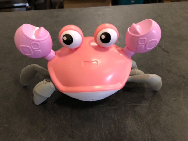 Photo 1 of Crawling Crab Baby Toy, Tummy Time Girl Gifts for Babies 3-6 6-12 Month, Light-Up Walking Dancing Moving Crab with Music & Obstacle Avoidance, Rechargeable Musical Toys 1 Year Old Girls Gift (Pink)