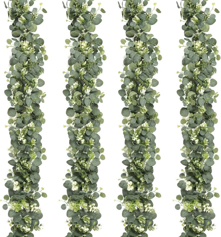 Photo 1 of SOMYTING Artificial Eucalyptus Garland Artificial Vines Hanging Eucalyptus Leaves Greenery Garland with Berries Vines Table Runner for Wedding Arch Home Party Mantle Decor (4 Packs)