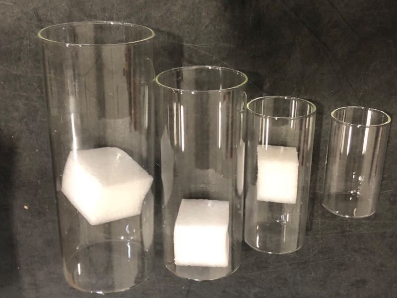 Photo 1 of 4 Pack Glass Cylinder Vases 4,6,8,10 Inch Tall Clear Flower Vase Hurricane Floating Candle Holder for Table Centerpiece Wedding Home Decor