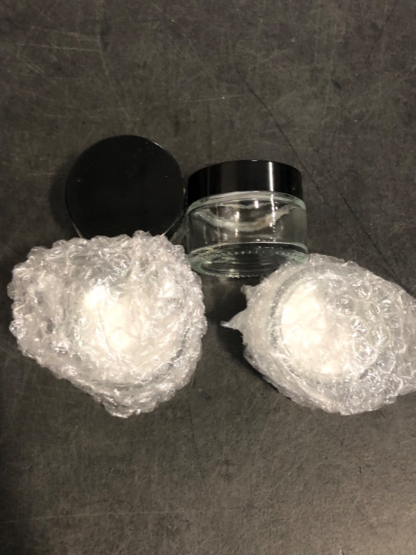 Photo 1 of 4 Pack 1oz Small Glass Containers with Lids, Glass Jars with Black Lids & Stickers, Mini Reusable Empty Container for Creams, Lotion, Cosmetic