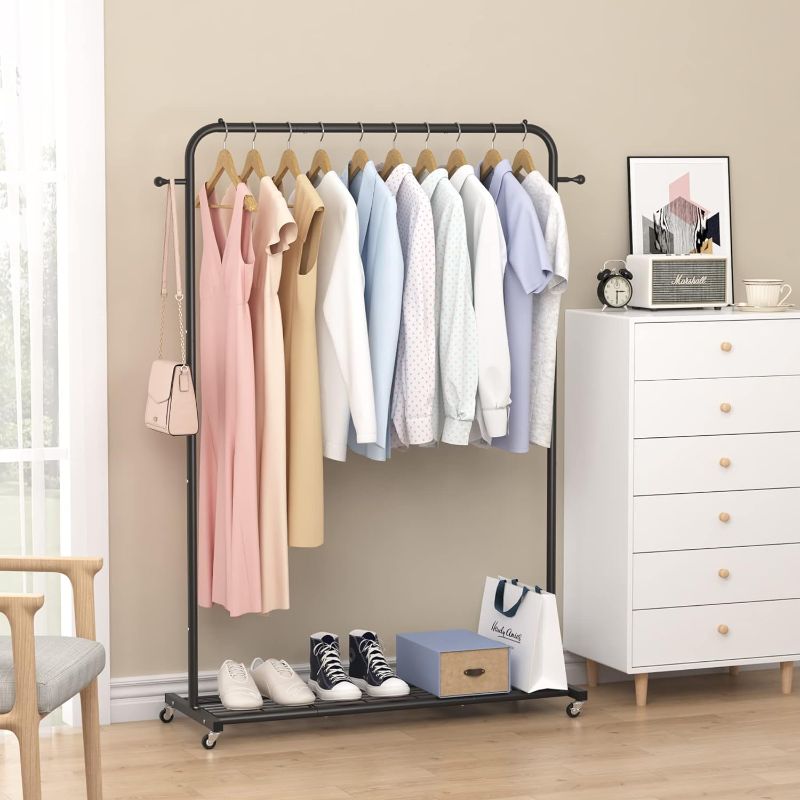 Photo 1 of Sywhitta Clothing Rack on Wheels with Mesh Storage Shelf & Sturdy Metal Frame, Rolling Garment Rack for Hanging Clothes, Coats, Skirts, 39.76" L x 16" W x 64.56" H,Black