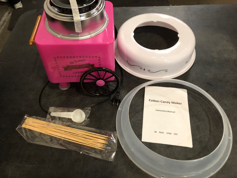 Photo 1 of Nostalgia Cotton Candy Machine - Retro Cotton Candy Machine for Kids with 2 Reusable Cones, 1 Sugar Scoop, and 1 Extractor Head – Pink