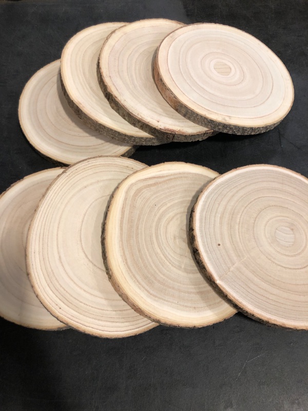 Photo 1 of Wood Slices 8 Pack 9-10.5Inch Large Wood Rounds Unfinished Wood Slices for Centerpieces,Ornaments,Wood Chargers,Wooden Slices forTables Decor,Crafts,DIY
