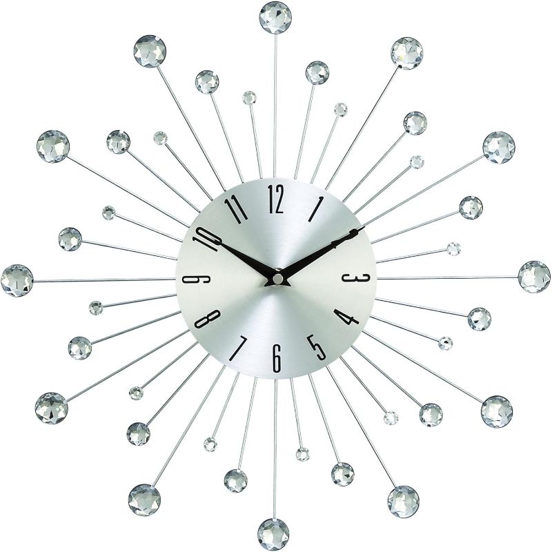 Photo 1 of Deco 79 Metal Starburst Decorative Wall Clock With Crystal Accents for Home and Room, 15" x 2" x 15", Silver