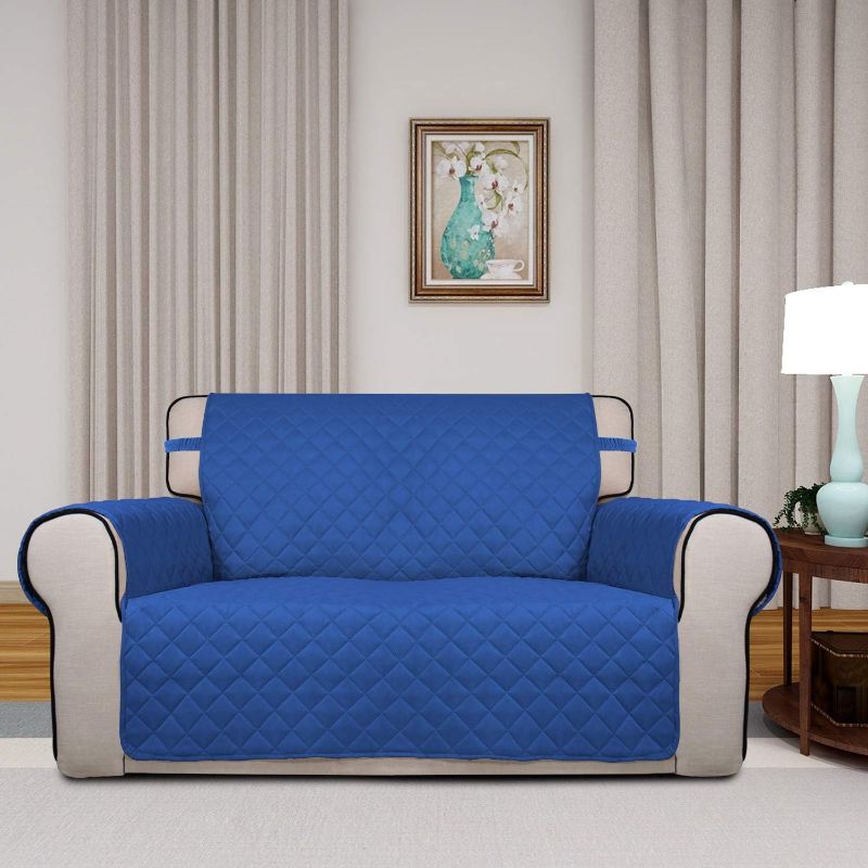 Photo 1 of PureFit Reversible Quilted Sofa Cover, Water Resistant Slipcover Furniture Protector, Washable Couch Cover with Non Slip and Elastic Straps for Kids, Pets (Loveseat, Classic Blue/Ivory)