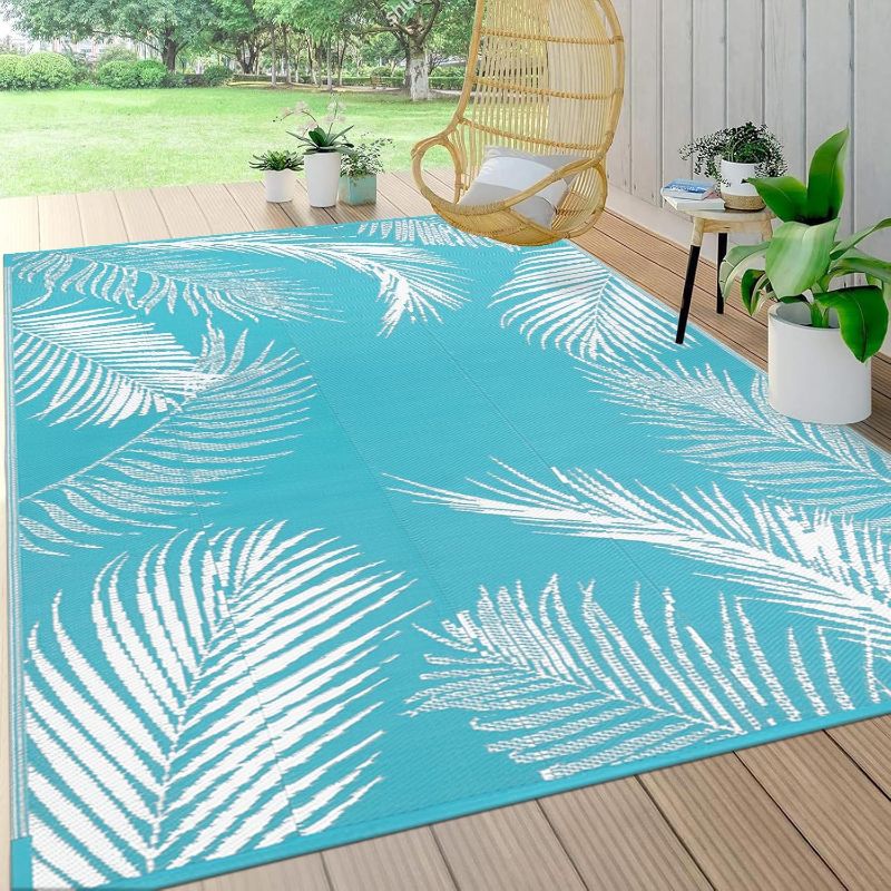 Photo 1 of Pauwer Waterproof Outdoor Rug 5x8, Reversible Plastic Straw Patio Camping Rug, Indoor Outdoor RV Mat Carpet for Deck, Camper, Porch, Balcony, Backyard, Picnic, Leaf Teal
