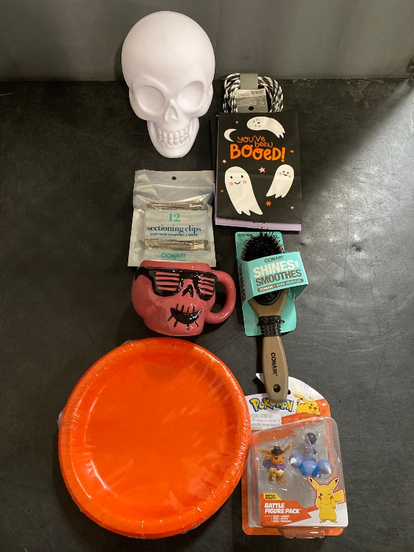 Photo 1 of 7 Item Seasonal & Party Supplies Bundle | 2 Hand Towels, 4 Gift Bags, 1 Cup, 2 Pokemon Toys, 1 Halloween Skull, 20 Plates, 12 Hair Clips, 1 Hair Brush