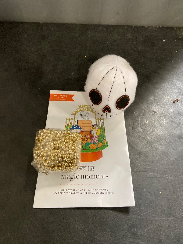 Photo 1 of Artisty's glass pearls. white felt skull. diplayable pop up.
