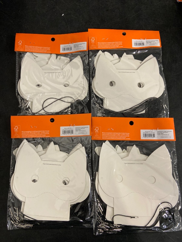 Photo 1 of (4) 24 count halloween masks.