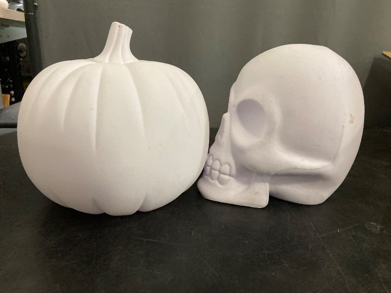 Photo 1 of Skull and pumpkin decorations. White.