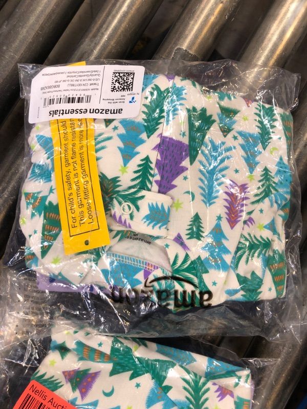 Photo 1 of Amazon Essentials Unisex Babies' Snug-Fit Cotton Footed Sleeper Pajamas, Pack of 3, Ecru Festive Tree/Navy/Purple Dots, 0-3 Months