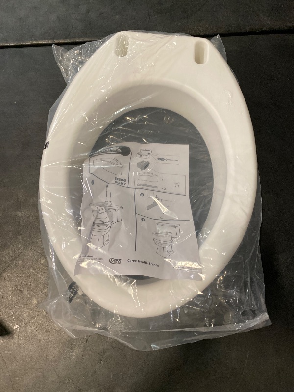 Photo 1 of Carex Toilet Seat Riser, Elongated Raised Toilet Seat Adds 3.5 inches to Toilet Height, for Assistance Bending or Sitting, 300 Pound Weight Capacity Toilet Riser