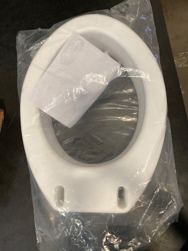 Photo 1 of Carex Toilet Seat Riser, Elongated Raised Toilet Seat Adds 3.5 inches to Toilet Height, for Assistance Bending or Sitting, 300 Pound Weight Capacity Toilet Riser