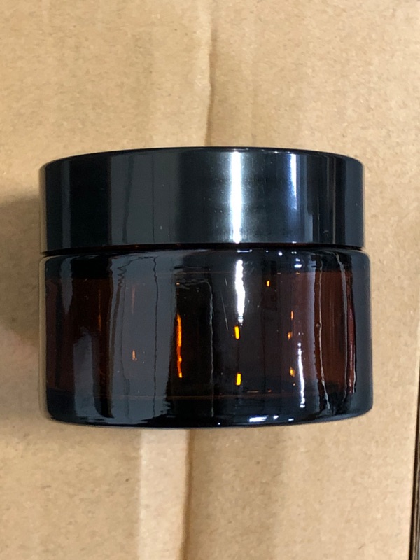 Photo 1 of ZIYIZE Amber Glass Jars with Lids, 4 Pack 1oz Small Glass Jars with Inner Liners, 30 ml Reusable Empty Round Cosmetic Container for Creams, Lotion, Cosmetic, Spice, Powder
