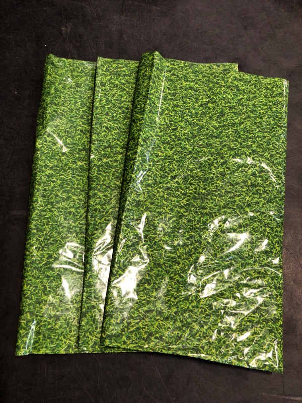 Photo 1 of Sparkle and Bash 3 Pack Green Grass Plastic Tablecloths (54 x 108 in) for Golf Party or Hole in One Birthday Table Covers & Decorations - Plastic Tablecloth - Table Cover