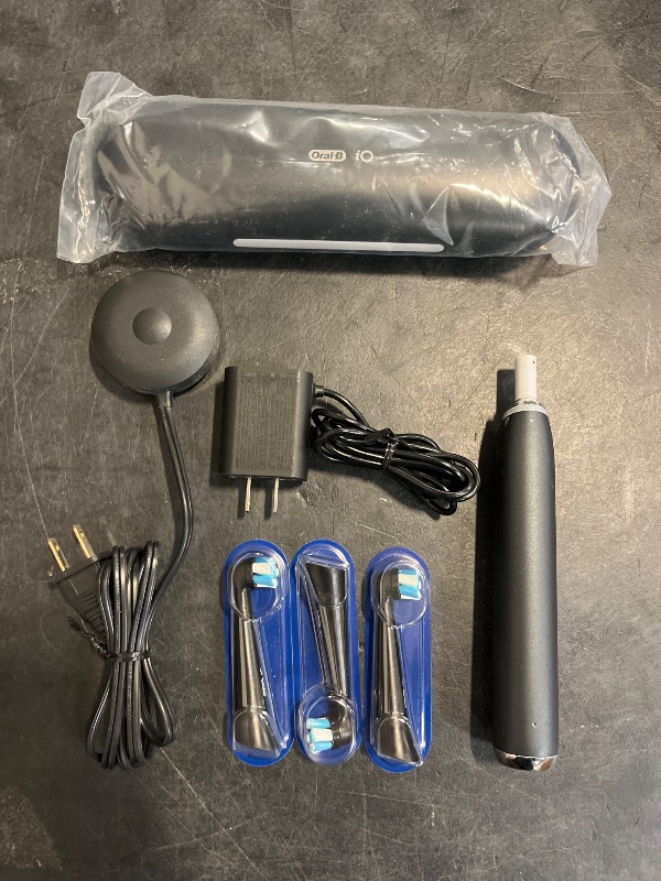 Photo 1 of Oral-B iO Series 9 Electric Toothbrush with 3 Replacement Brush Heads, Black Onyx