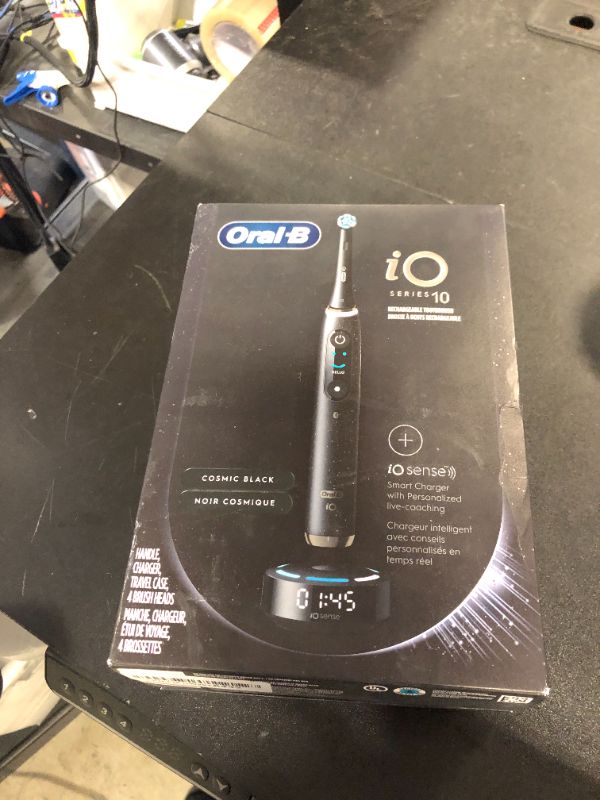 Photo 1 of Oral-B iO Series 10 Rechargeable Electric Toothbrush with Visible Pressure Sensor to Protect Gums, 2 Min Timer, 7 Cleaning Settings, 4 Replacement Toothbrush Heads, and Charging Travel Case, Black