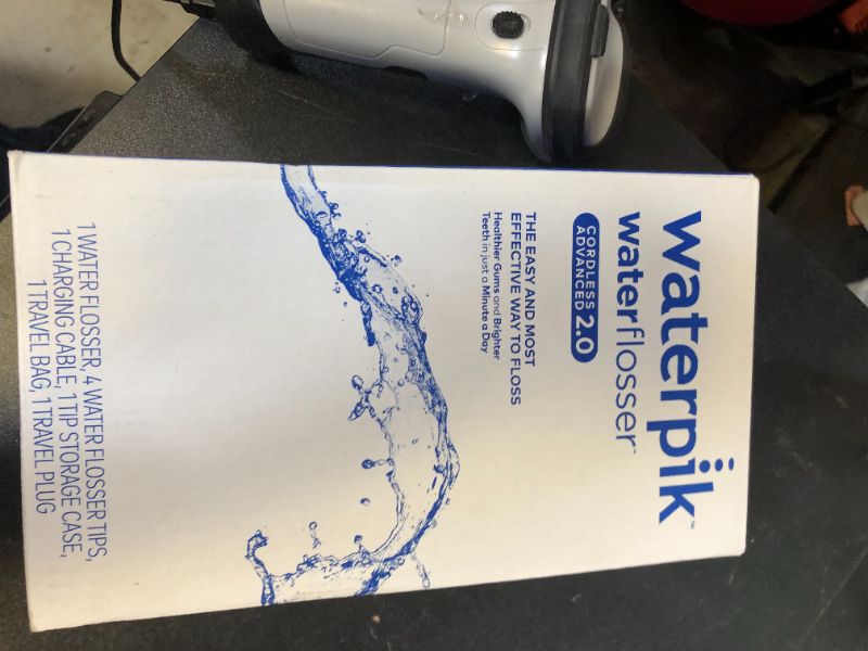 Photo 1 of Waterpik Cordless Advanced 2.0 Water Flosser For Teeth, Gums, Braces, Dental Care With Travel Bag and 4 Tips, ADA Accepted, Rechargeable, Portable, and Waterproof, Blue WP-583, Packaging May Vary