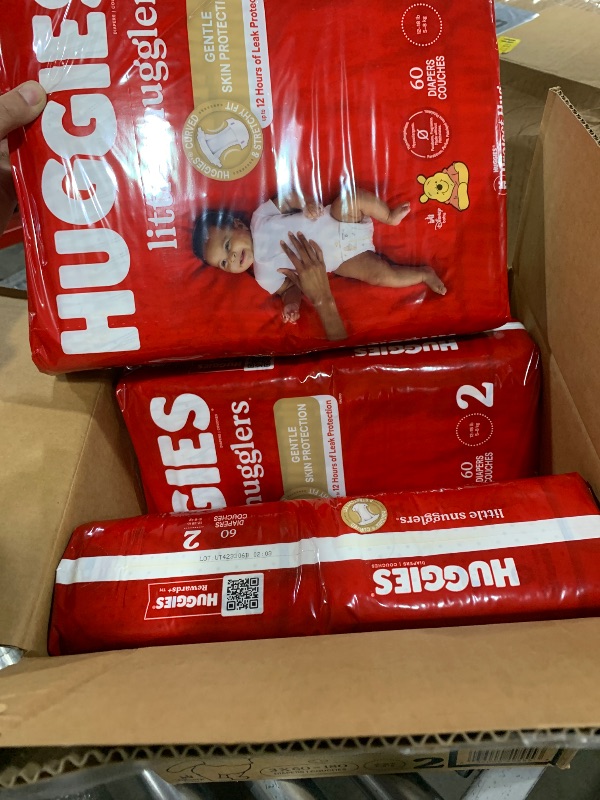 Photo 1 of Huggies Size 2 Diapers, Little Snugglers Baby Diapers, Size 2 (12-18 lbs), 180 Ct (3 packs of 60), Packaging May Vary