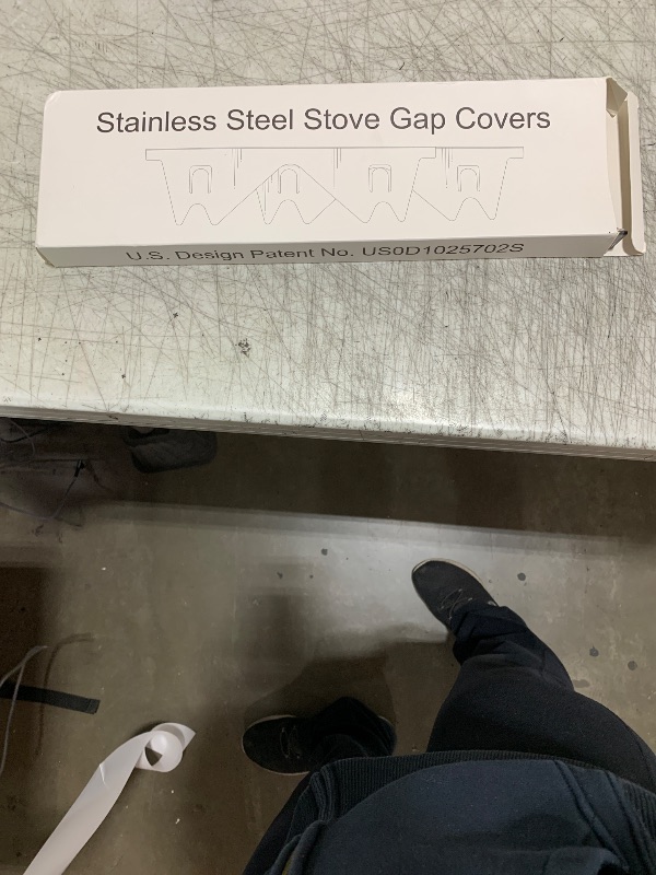 Photo 1 of Stainless Steel Stove Gap Covers,Stove Gap Filler, Range Trim Kit, Stove Gap Guards, Heat Resistant and Easy to Clean, Easy retractable Length 13.8" to 27.5", Width 0.79",Black(2PCS)
