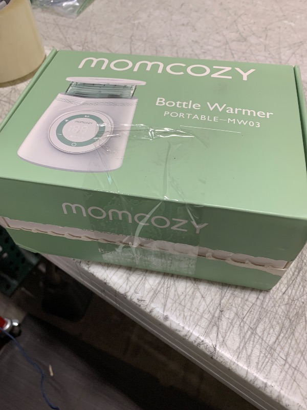 Photo 1 of Momcozy Portable Bottle Warmer for Travel, Double Leak-Proof Travel Bottle Warmer with Fast Heating, Safety Material Baby Bottle Warmer for Dr. Brown, Philips Avent, Medela, Tommee Tippee, Comotomo