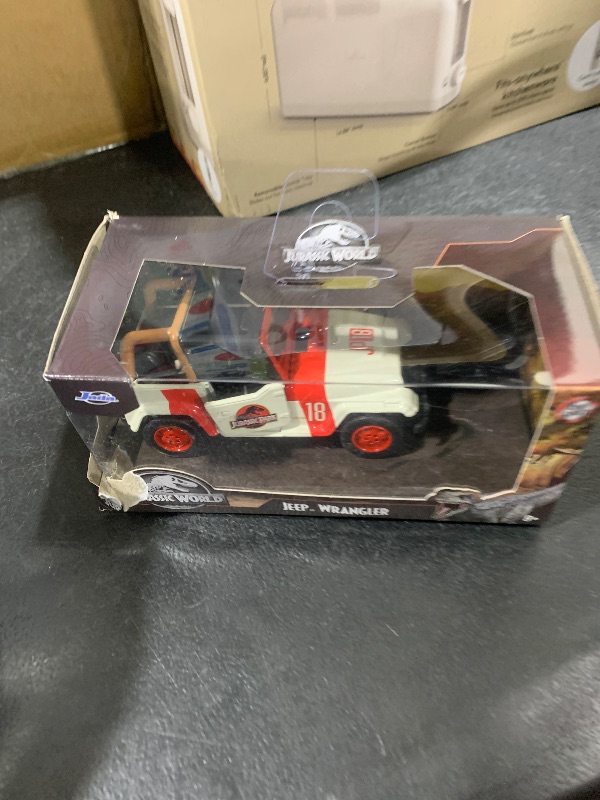Photo 1 of Jada Toys Jurassic World 1:32 Jeep Wrangler Die-cast Car, Toys for Kids and Adults,White/Red