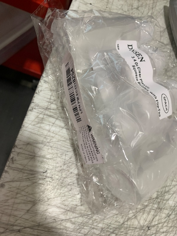 Photo 1 of DNSEN 4 Pack 3.4oz Empty Plastic Travel Bottles for Toiletries TSA Approved Leak Proof Squeezable Travel Size Containers Travel Essentials Accessories, clear