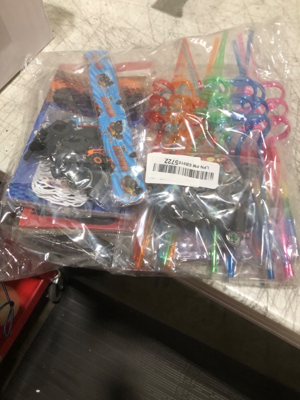 Photo 1 of Miucat Monster Truck Party Favors Serve 12, Machine Jam Birthday Supplies include Slap Bracelet Coloring Books with Stacking Crayons Drinking Straws Keychain Stickers Gift Bags for Kids 122Pcs