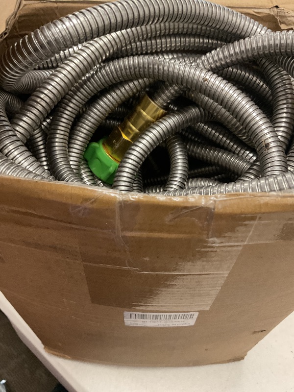 Photo 1 of Metal Garden Hose 100FT, Stainless Steel Heavy Duty Water Hose with 10 Function Nozzle & Brass Nozzle, Sturdy and Lightweight, No Kink & Tangle, Easy to Use & Store, Suitable for Yard and Lawn