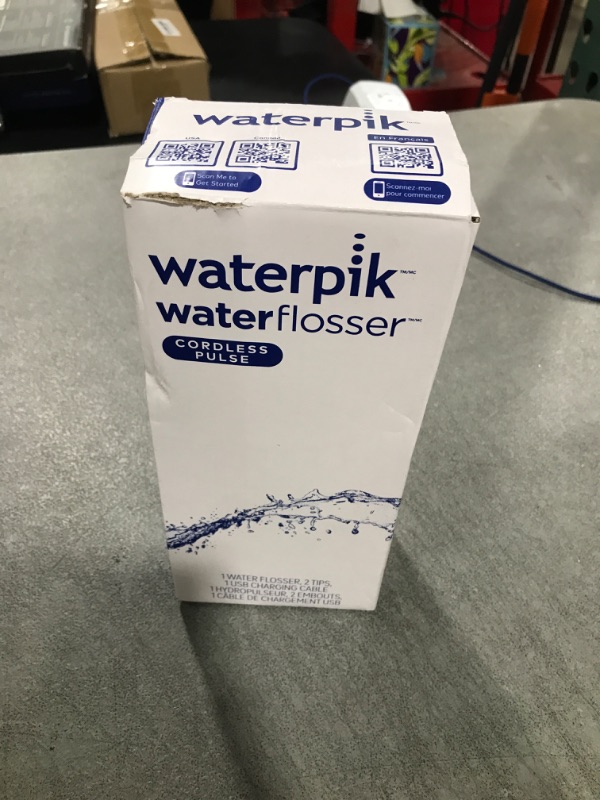 View 2 of Waterpik Cordless Pulse Rechargeable Portable Water Flosser for Teeth, Gums, Braces Care and Travel with 2 Flossing Tips, Waterproof, ADA Accepted, WF-20 White, Packaging May Vary