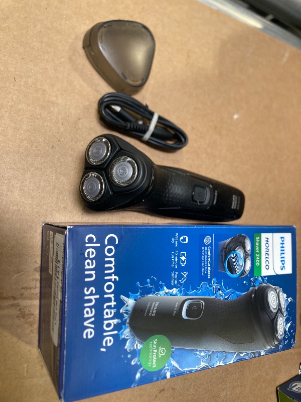 Photo 1 of Philips Norelco Shaver 2400 Series, Wet and Dry Electric Shaver, Pop-up Trimmer, P-Cap, Deep Black, Model X3001/90