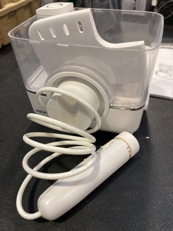 Photo 1 of Waterpik ION Professional Water Flosser, Rechargeable and Portable for Teeth, Gums, Braces, 10 Settings, 7 Flossing Tips For Multiple Users And Needs, ADA Accepted, WF-12 White