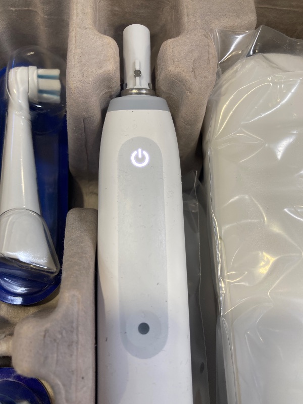 Photo 1 of Oral-B iO Deep Clean Rechargeable Electric Powered Toothbrush, White with iO Series 3 Limited, 2 Brush Heads and Travel Case - Pressure Sensor to Protect Gums - 3 Cleaning Settings - 2 Minute Timer
