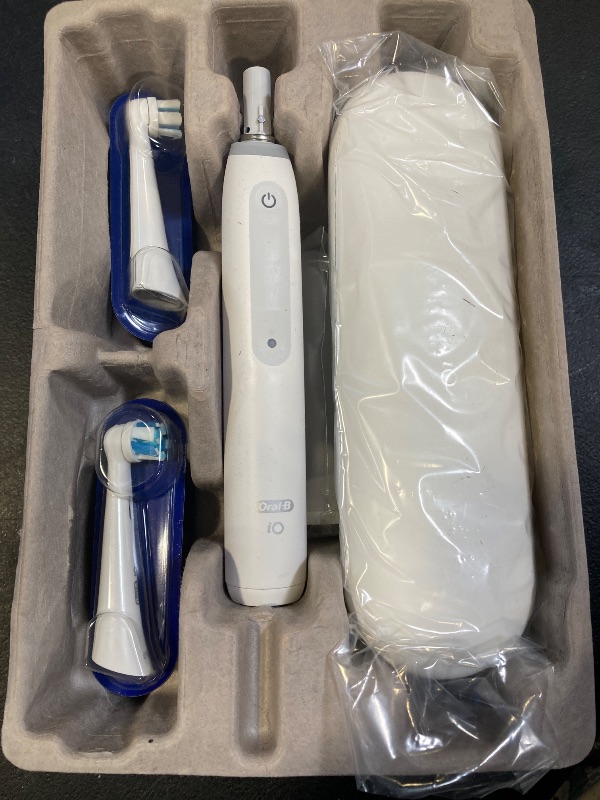 Photo 1 of Oral-B iO Deep Clean Rechargeable Electric Powered Toothbrush, White with iO Series 3 Limited, 2 Brush Heads and Travel Case - Pressure Sensor to Protect Gums - 3 Cleaning Settings - 2 Minute Timer