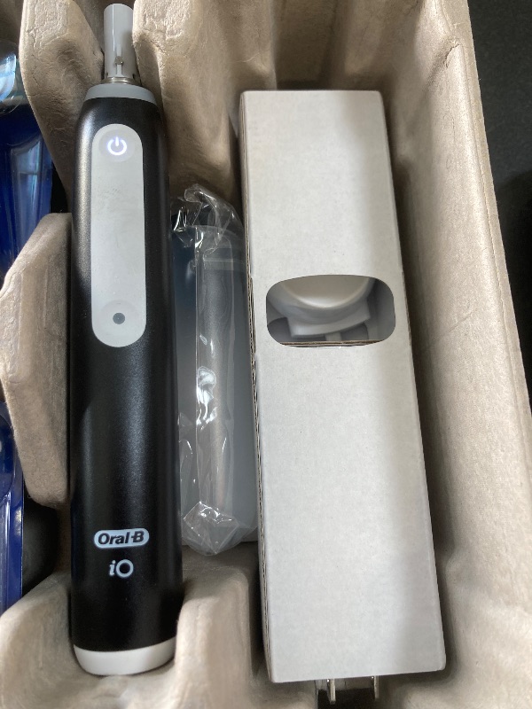 Photo 1 of Oral-B iO Deep Clean Rechargeable Electric Powered Toothbrush, Black with iO Series 3 Limited, 2 Brush Heads and Travel Case - Pressure Sensor to Protect Gums - 3 Cleaning Settings - 2 Minute Timer