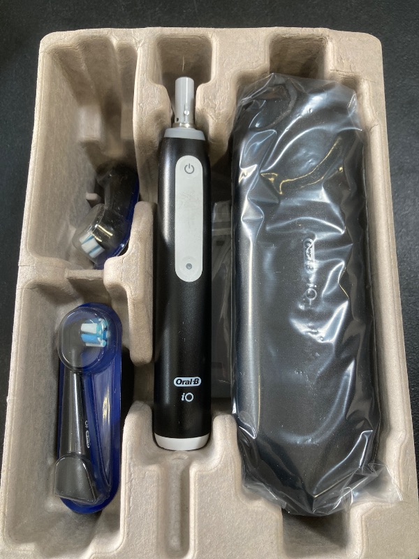 Photo 1 of Oral-B iO Deep Clean Rechargeable Electric Powered Toothbrush, Black with iO Series 3 Limited, 2 Brush Heads and Travel Case - Pressure Sensor to Protect Gums - 3 Cleaning Settings - 2 Minute Timer