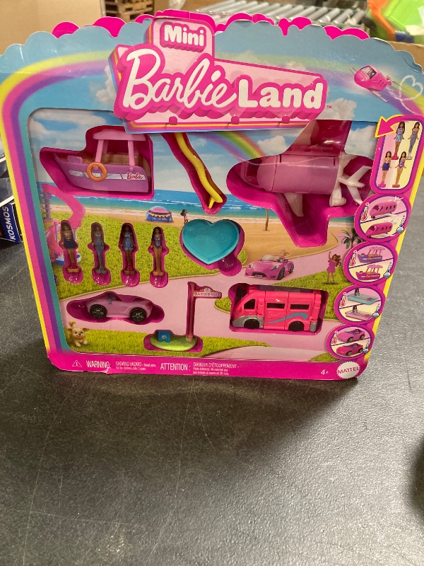 Photo 1 of Barbie Mini BarbieLand Multi-Pack Doll & Toy Vehicle Set with 4 Dolls 1.5-inches Tall & 4 Iconic Vehicles with Color-Change Surprise