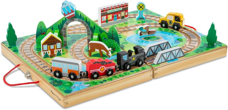 Photo 1 of Melissa & Doug 17-Piece Wooden Take-Along Tabletop Railroad, 3 Trains, Truck, Play Pieces, Bridge